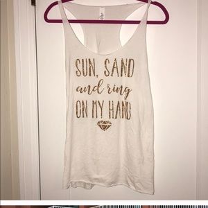 Sun sand and a ring on my hand tank